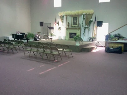 Chairs and platform in an Academy gathering room in 2012.