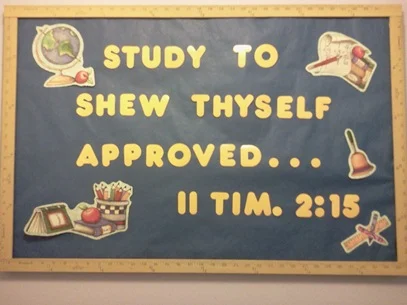 Academy bulletin board displaying Study to shew thyself approved, 2 Timothy 2:15, in 2012.